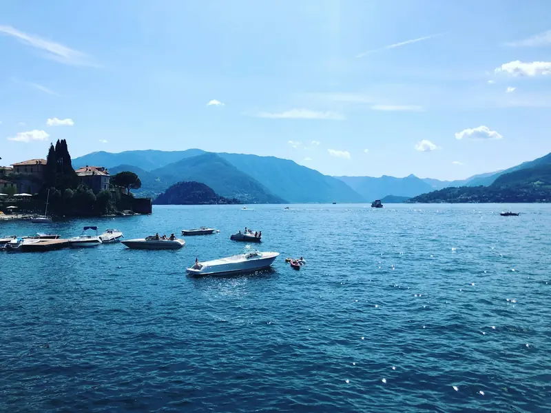 Boats on Lake Como near Bellagio, mountains beyond