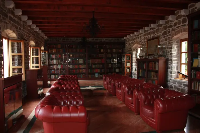 A private library lounge with leather chesterfield seating